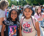 First day of school photo 2024. Two elementary students getting ready to go into the school.