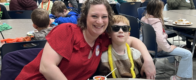 Families enjoying breakfast at a Read Across America event.